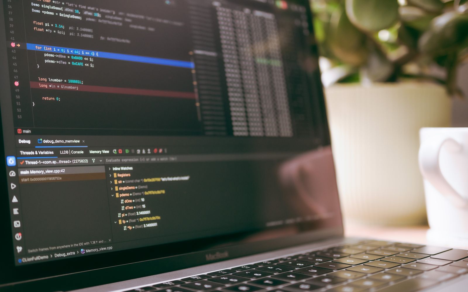 A laptop screen showing programming code and debugging tools, ideal for tech topics.