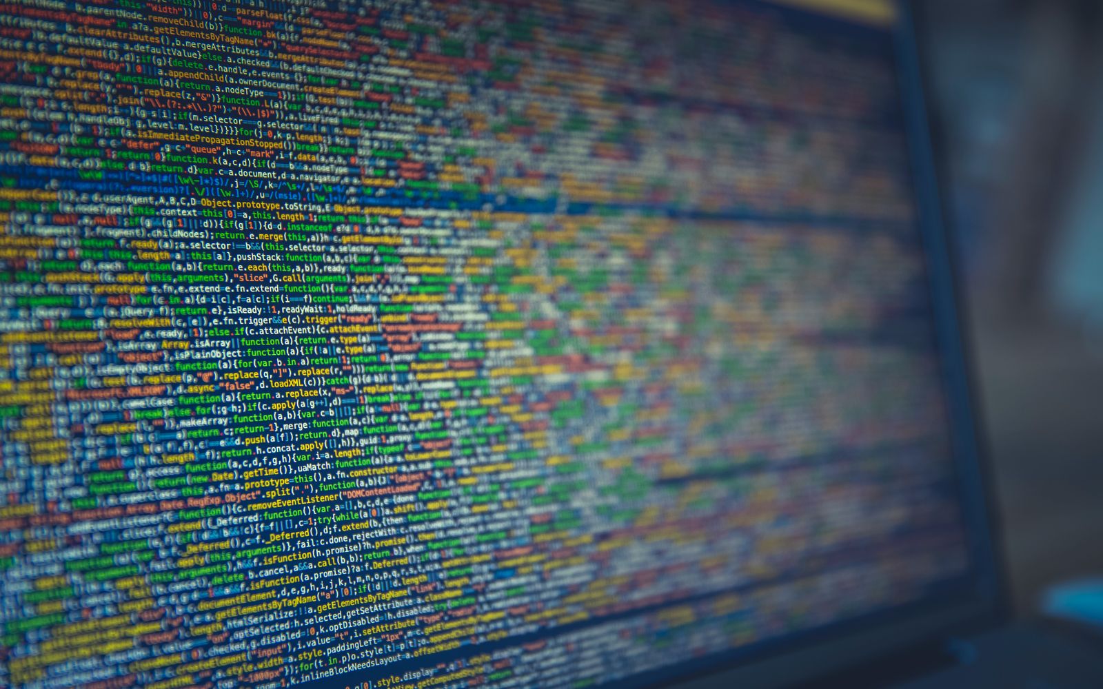 A detailed view of colorful source code displayed on a computer screen, representing modern programming and technology.