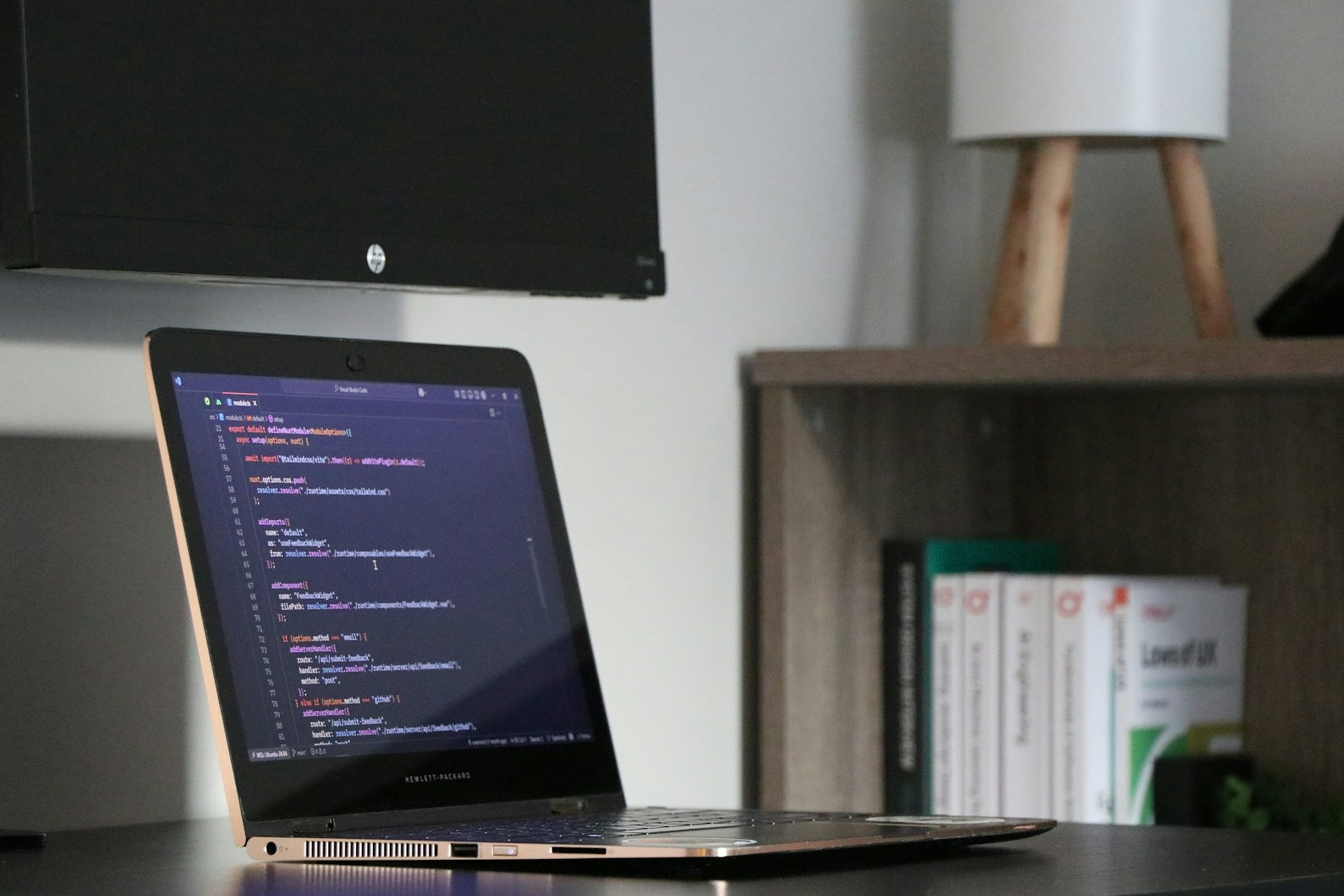 A laptop showing code during a technical project review.