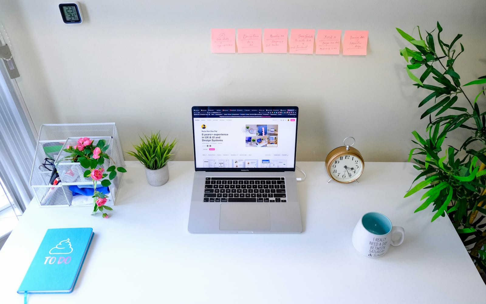 a laptop computer sitting on top of a white desk