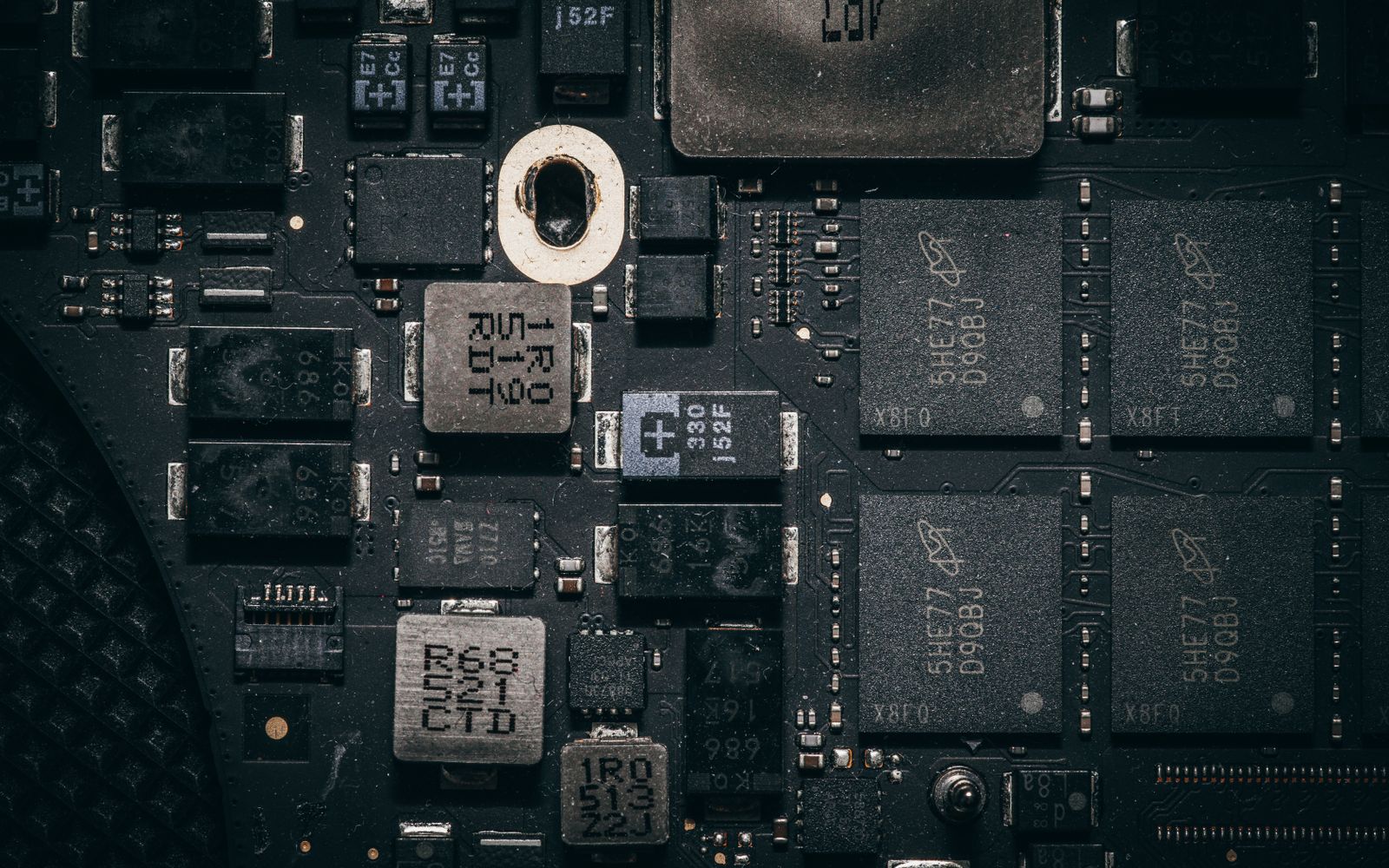 Detailed close-up of a computer circuit board highlighting electronic components and intricate design.